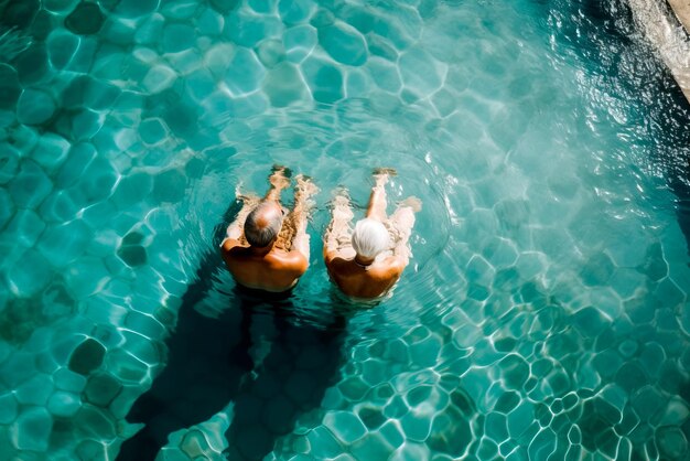 Aerial view of couple in love swimming in the swimming pool Generative AI