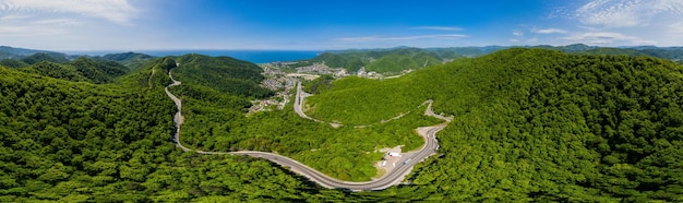 Aerial view of a curved winding road trough the caucasus mountai