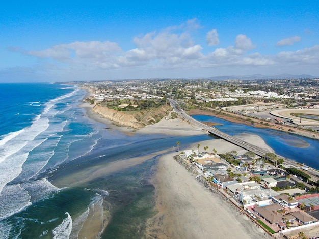 Aerial view of Del Mar North Beach, California coastal cliffs and House with blue Pacific ocean