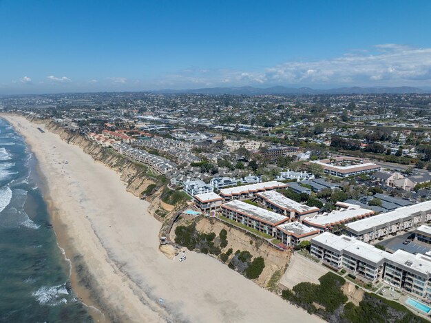 Aerial view of del mar shores california coastal cliffs and house with blue pacific ocean san diego