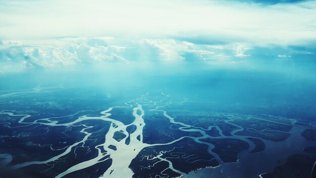 Photo aerial view of delta against cloudy sky