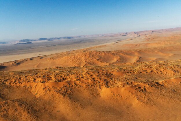 Photo aerial view of desert against sky