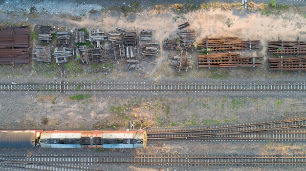 Aerial view of diesel locomotive Train and railway tracks - top view pov of Industrial conceptual scene with trains