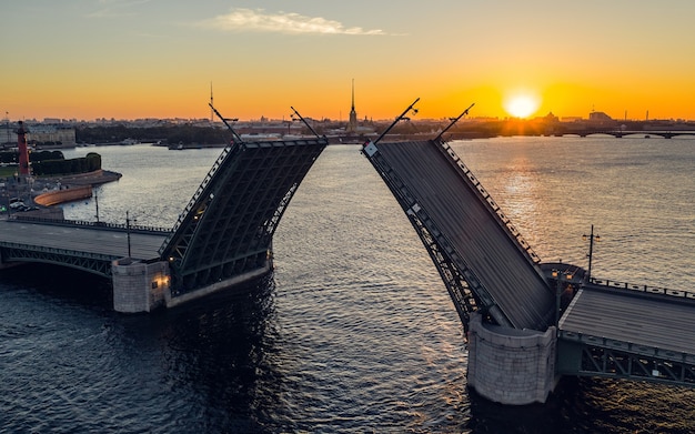 Aerial view of divorced Palace Bridge in St. Petersburg during sunrise