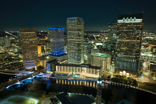 Aerial view of downtown district of Tampa city in Florida USA Brightly illuminated high skyscraper buildings and moving traffic in modern american midtown