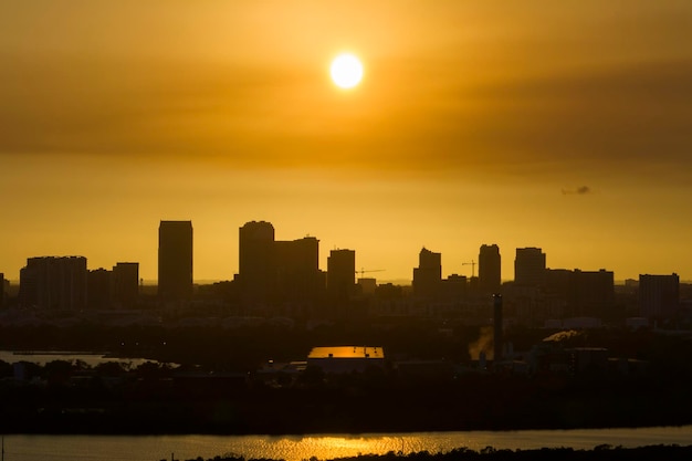 Aerial view of downtown district of Tampa city in Florida USA at sunset Dark silhouette of high skyscraper office buildings in modern american midtown