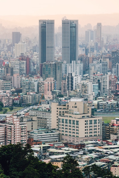 Aerial view over Downtown Taipei with layers of mountain 