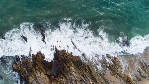 Aerial view drone shot of seascape scenic off beach in phuket thailand with wave crashing