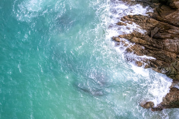 Aerial View Drone shot of waves crashing on seashore Sea ocean background