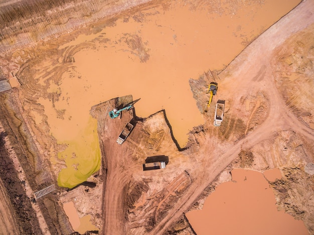 Aerial view of excavator and truck working