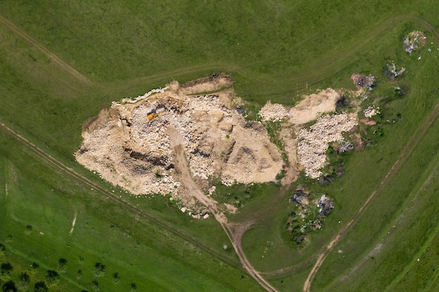 Aerial view of excavator working in a limestone quarry