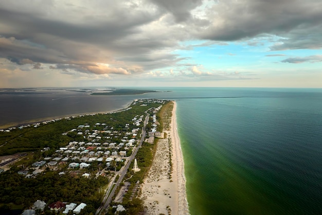 Aerial view of expensive residential houses in island small town Boca Grande on Gasparilla Island in southwest Florida American dream homes as example of real estate development in US suburbs