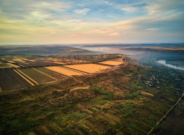 Aerial view on the field during sunset. Landscape from drone. Agricultural landscape from air. Agriculture - image