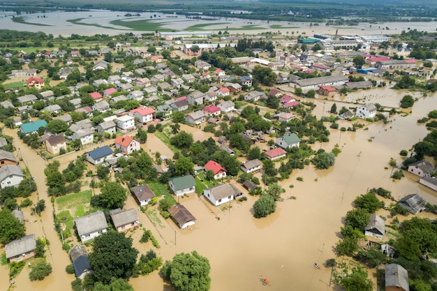 Aerial view of flooded houses with dirty water of dnister river\
in halych town, western ukraine.