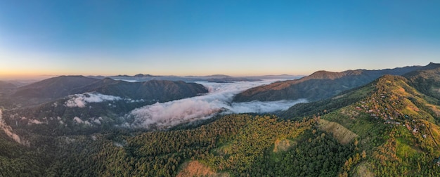 Aerial view forest in morning fog mist, breathing mountains, Sunshine on The Morning Mist. (Huay Hub Kab) Chaing mai Thailand.