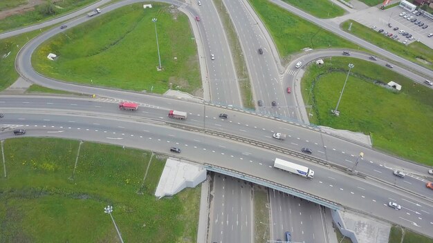 Aerial view of a freeway intersection clip highway and overpass with cars and trucks interchange