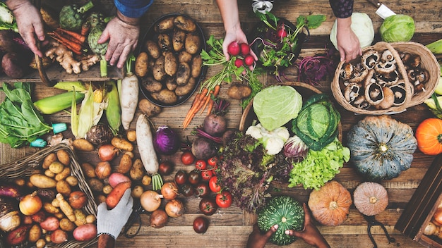 Aerial view of fresh organic various vegetable on wooden table