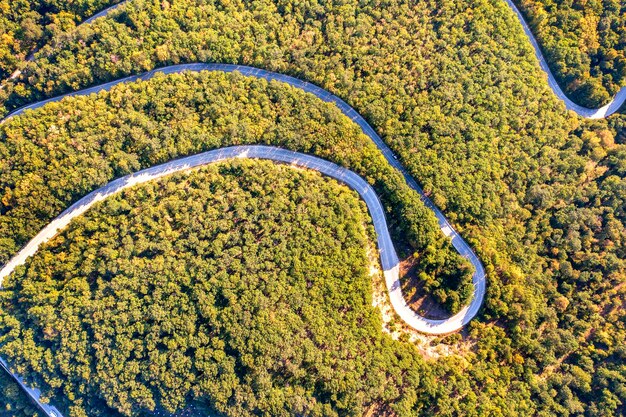 Aerial view from drone of curves of mountain road Transportation and infrastructure concept