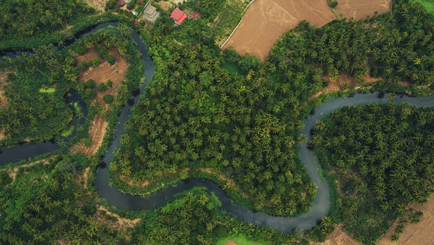 aerial view from drone of devious river and agriculture area 