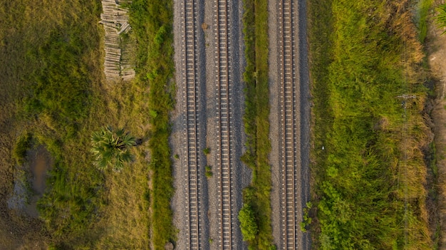 Aerial view from flying drone of railroad tracks, train