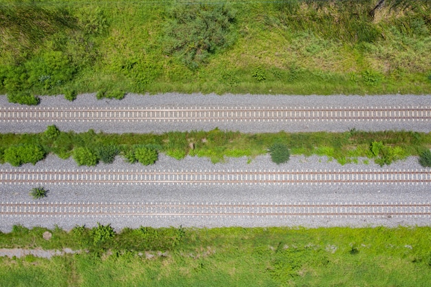 aerial view from flying drone of railroad tracks, train