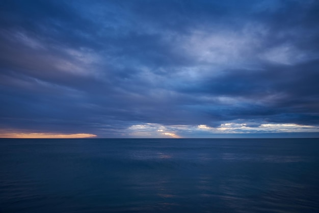 Aerial view from a flying drone of sunrise over sea