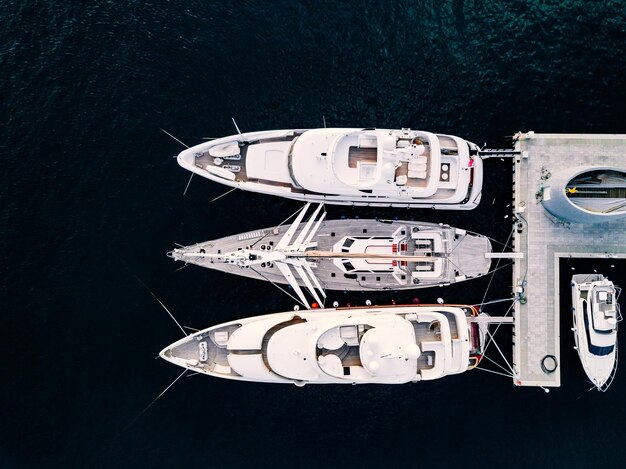 Aerial view from above at the luxury yachts in the marina in Italy