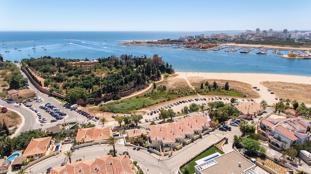 Aerial. View from the sky entrance to marina port of Portimao. Carvoeiro.