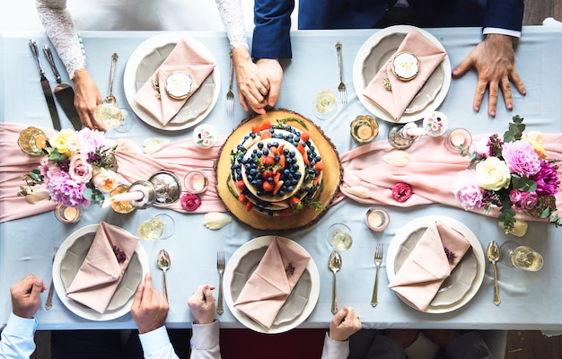 Aerial view of fruity wedding cake on wedding reception table