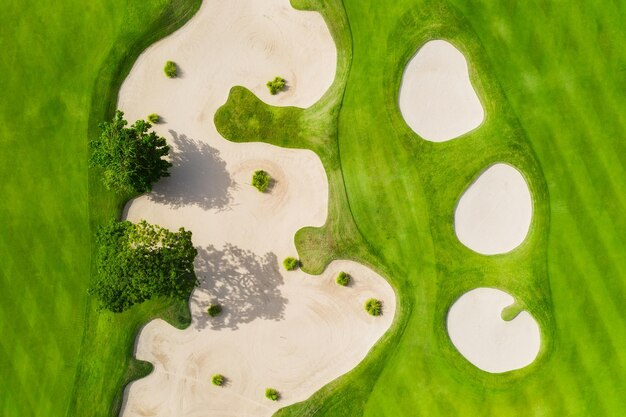 Aerial view on the golf course green grass on the athletic field sports and competition view from drone