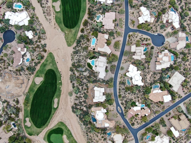 Aerial view above golf course and upscale luxury homes in Scottsdale Phoenix Arizona