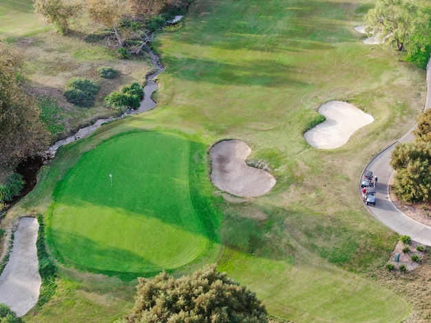 Aerial view over golf field Large and green turf golf course in South California USA