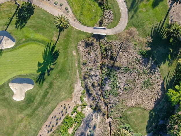 Aerial view over golf field. Large and green turf golf course in South California. USA