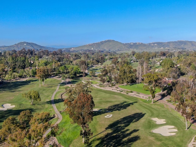 Aerial view over golf field. Large and green turf golf course in South California. USA