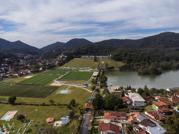 Aerial view of granja comary and the lake in the city of\
teresopolis mountain region of rio de janeiro brazil drone photo\
brazilian football team and brazilian football confederation