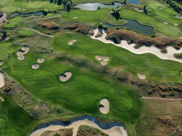 Aerial view of the green grass of the golf course.