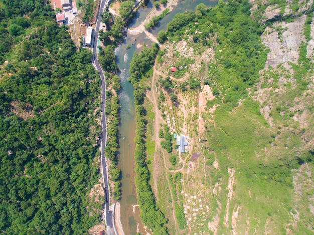 Aerial view of green mountain with river