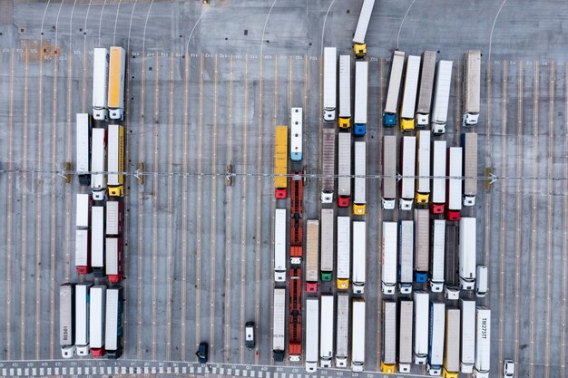 Photo aerial view of harbor and trucks parked along side each other getting ready for embarking the dover