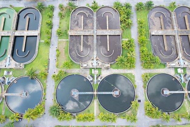 Aerial view high angle view top down drone shot of the sewage\
treatment plantthe solid contact clarifier tank type sludge\
recirculation in water treatment plant industrial wastewater\
treatment plant