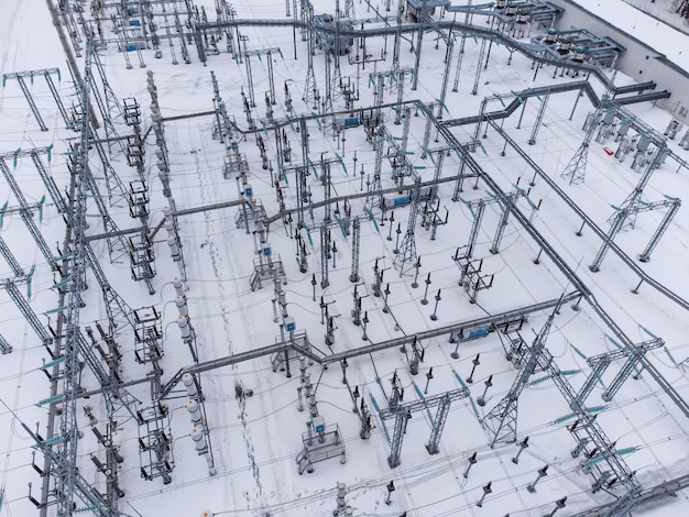 Aerial view of a high voltage electrical substation in winter season