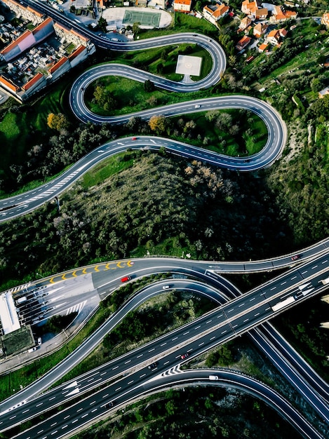 Aerial view of highway expressway and motorway with a toll payment point in rural Italy