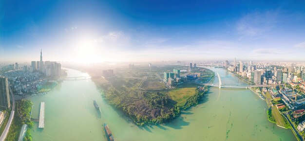 Aerial view of ho chi minh city skyline and skyscrapers on saigon river center of heart business at downtown morning view far away is landmark 81 skyscraper