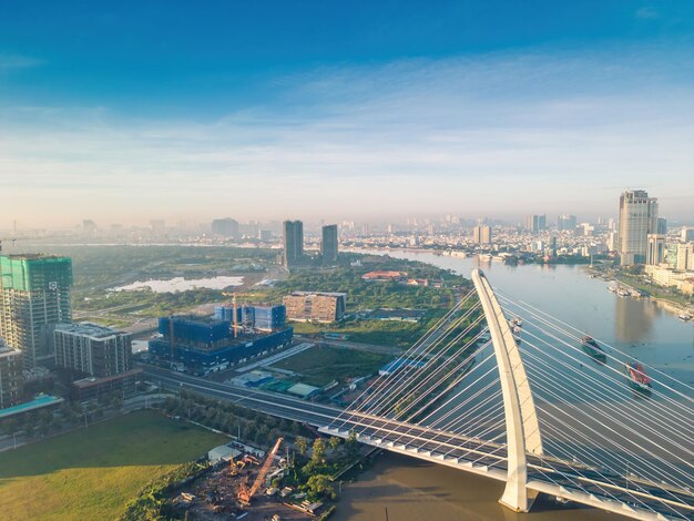 Aerial view of ho chi minh city skyline and skyscrapers on saigon river center of heart business at downtown morning view far away is landmark 81 skyscraper