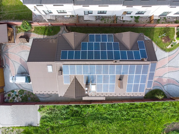 Aerial view of house with solar roof clean energy