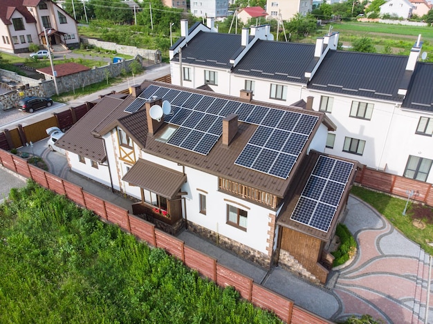 Aerial view of house with solar roof clean energy