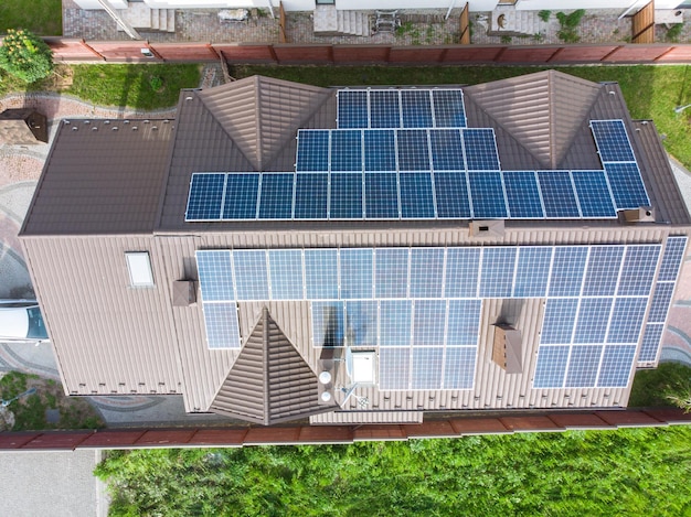 Aerial view of house with solar roof clean energy