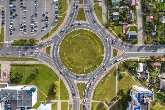 Aerial view of huge road junction of freeway with heavy traffic at city