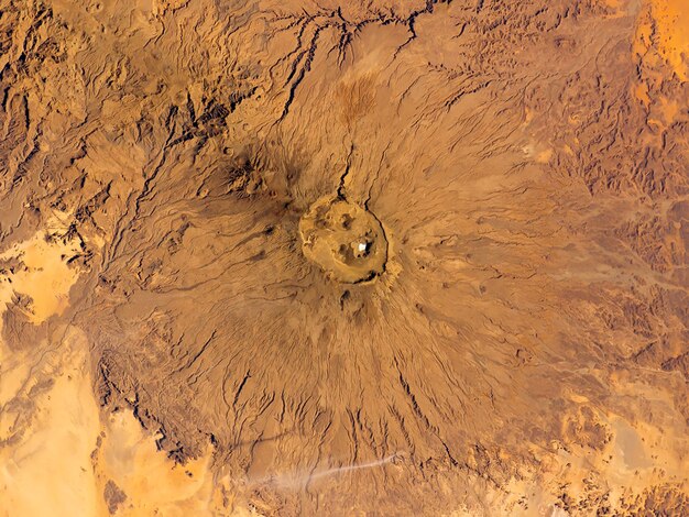 Aerial view of a inactive volcanic peak in sahara elements of\
this image furnished by nasa