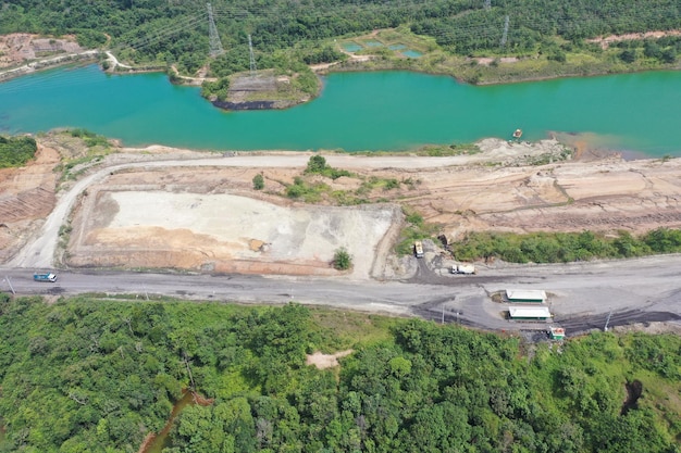 Aerial view industrial of opencast coal mining with lots of\
machinery at work - view from above.