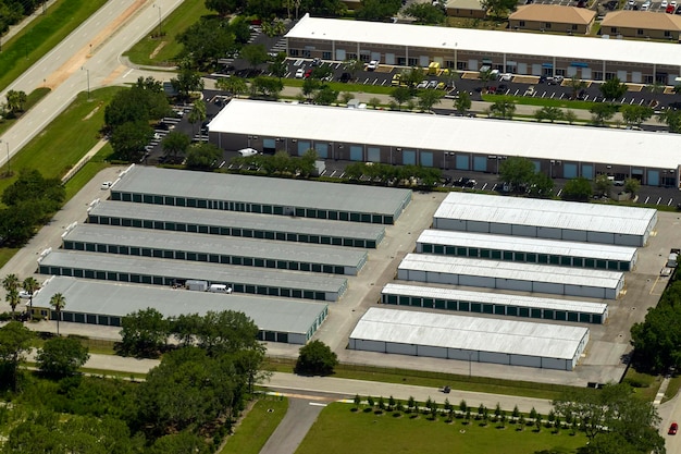 Aerial view of industrial park with goods warehouses and logistics centers in city zone from above